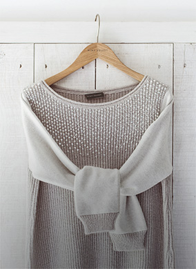 grey jumper on a hanger