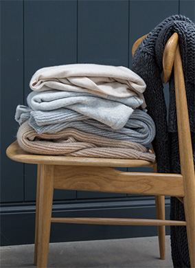 clothes piled on a chair